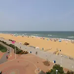 Oceanfront Beach, Sky, & Dolphins
